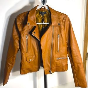 A Love tree leather jacket. New with tags.size medium Juniors/cognac in color